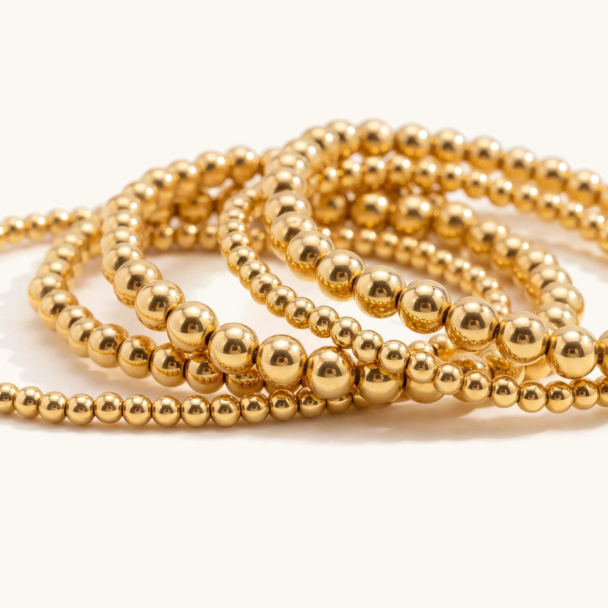 7pcs Gold Beaded Bracelet Stack, close-up of the gold beads