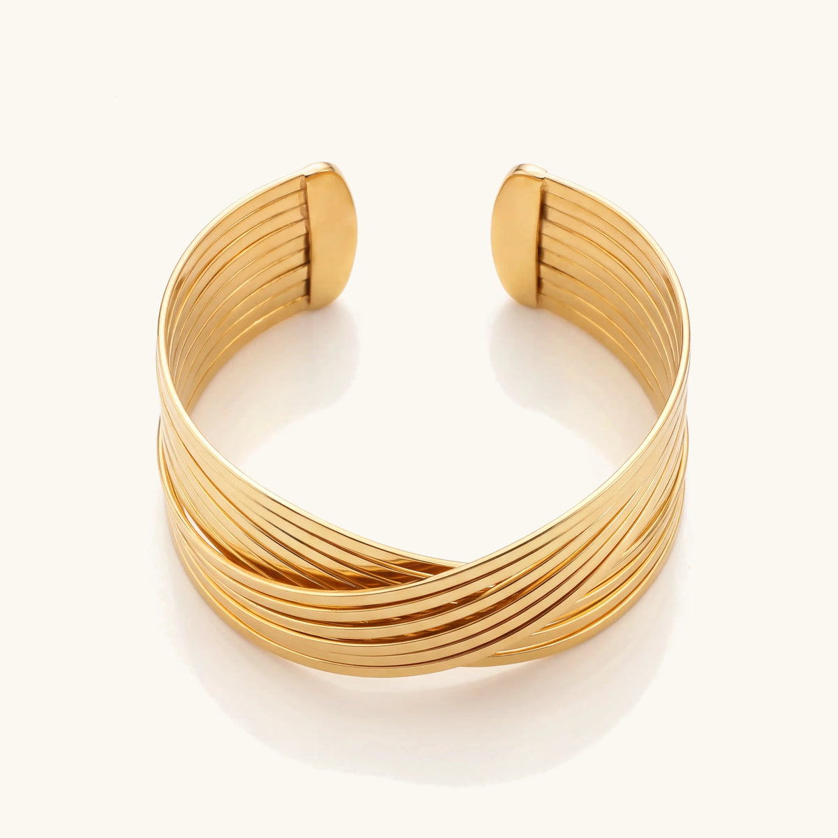 Spiral Cross Wrap Bangle Bracelet in gold, view from above