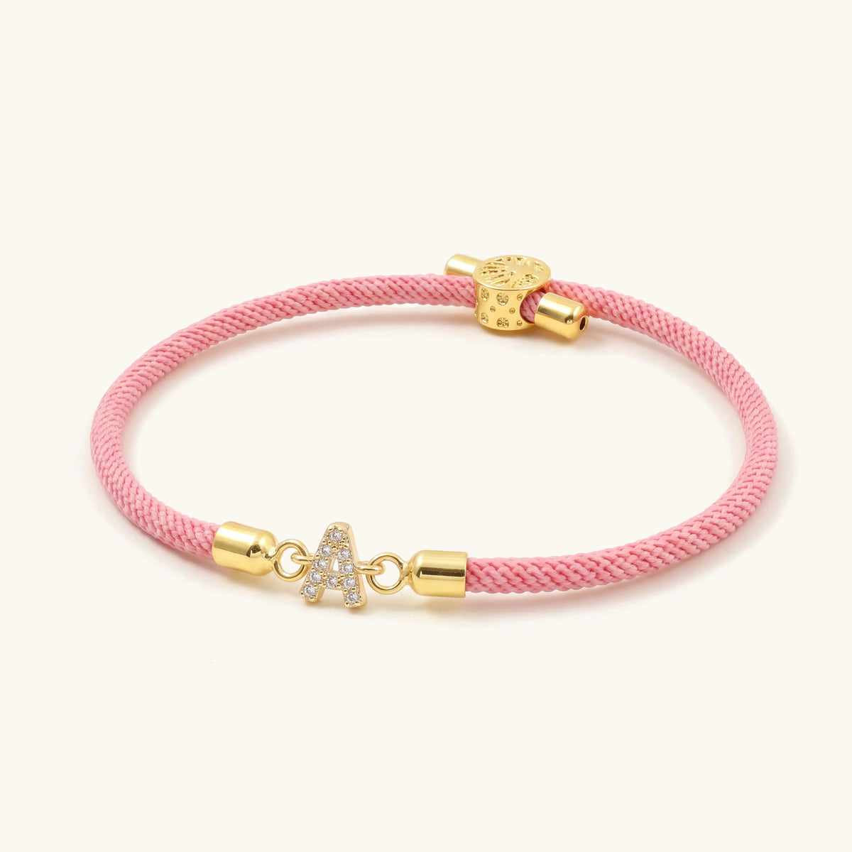 Adjustable Letter Initial Bracelet – pink cord bracelet with gold pavé initial and slider bead