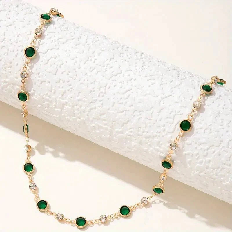 Emerald and diamond spaced choker necklace