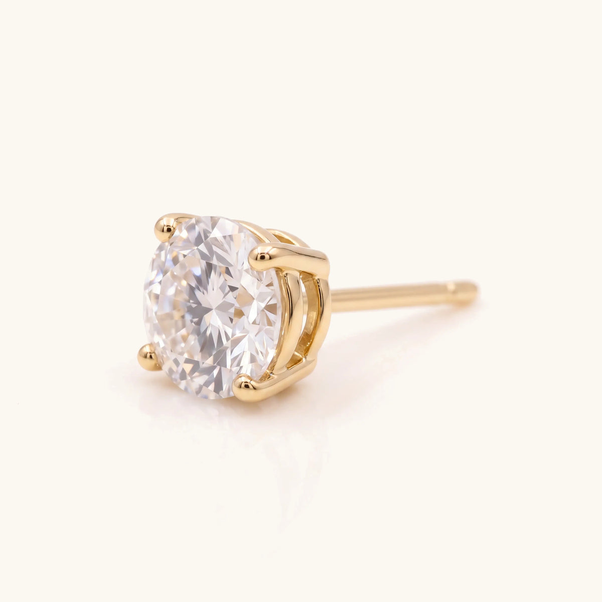Classic Diamond Stud Earring in gold, side view of the four-prong setting