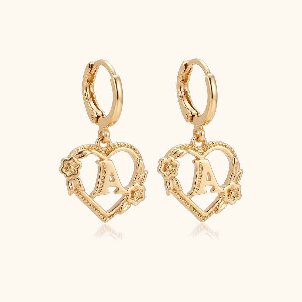 Dainty Initial Letter Heart Hoop Earrings – pair of gold huggie hoops with floral heart initial charms