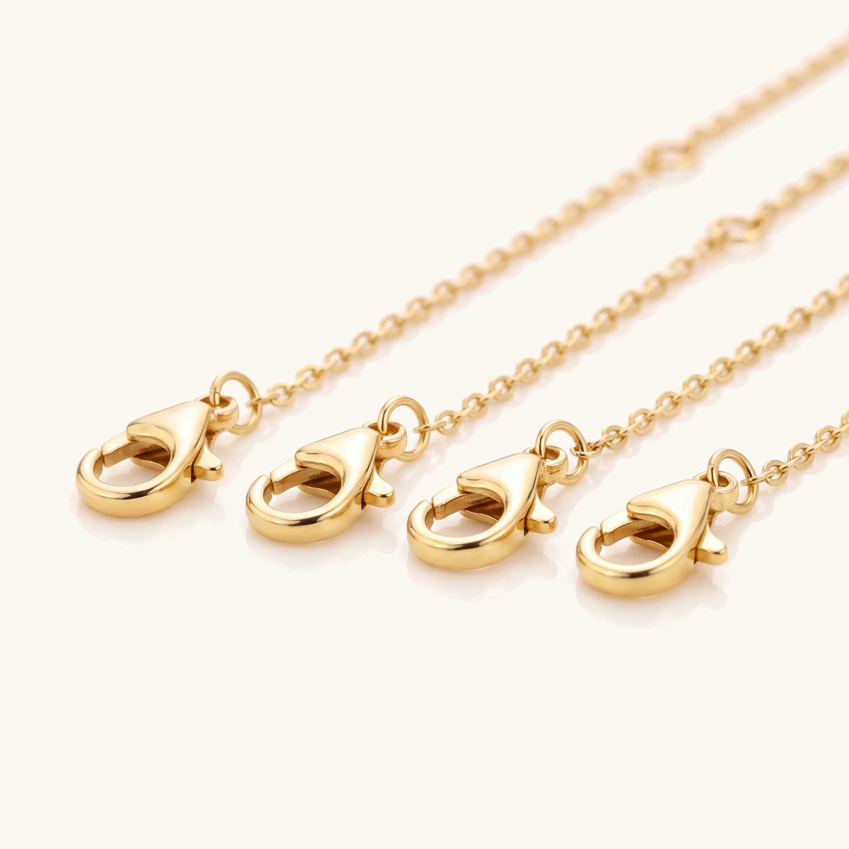 Close-up of the gold lobster clasps on the necklace extenders