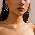 Load image into Gallery viewer, Floral Knot Outline Earrings
