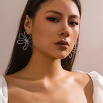 Load image into Gallery viewer, Floral Knot Outline Earrings
