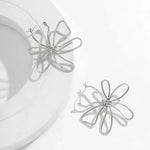 Load image into Gallery viewer, Floral Knot Outline Earrings
