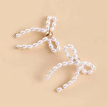 Load image into Gallery viewer, Iconic Dainty Pearl Bow Earrings
