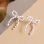 Load image into Gallery viewer, Iconic Dainty Pearl Bow Earrings
