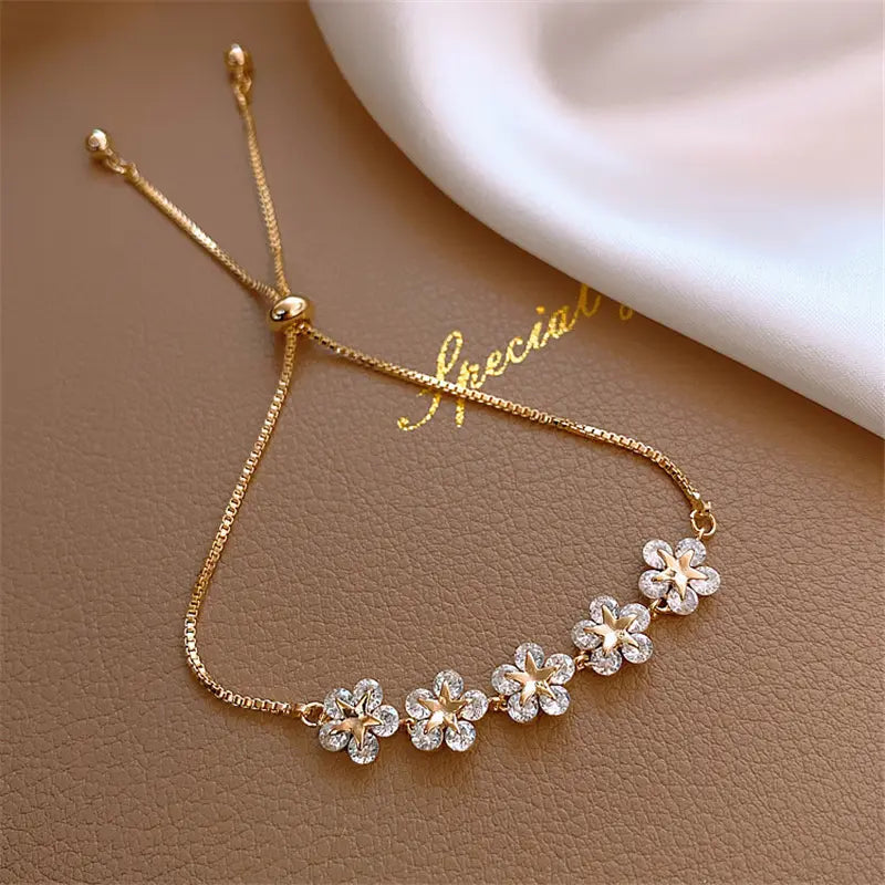 Charming Crystal Daisy Bracelet in Gold