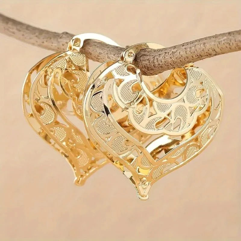 Intricate open heart golden earrings