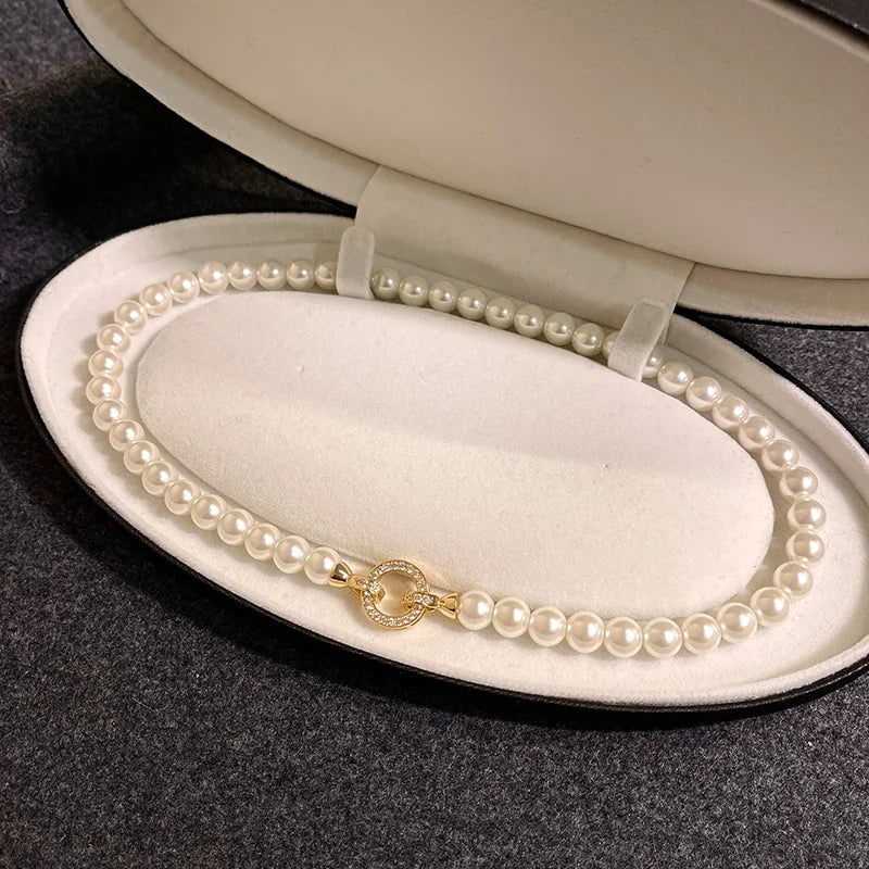 Pearl diamond accented circle pendant bracelet and necklace