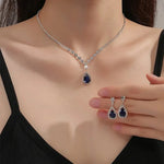 Load image into Gallery viewer, Shimmering Blue Teardrop Diamond Necklace and Earrings Set

