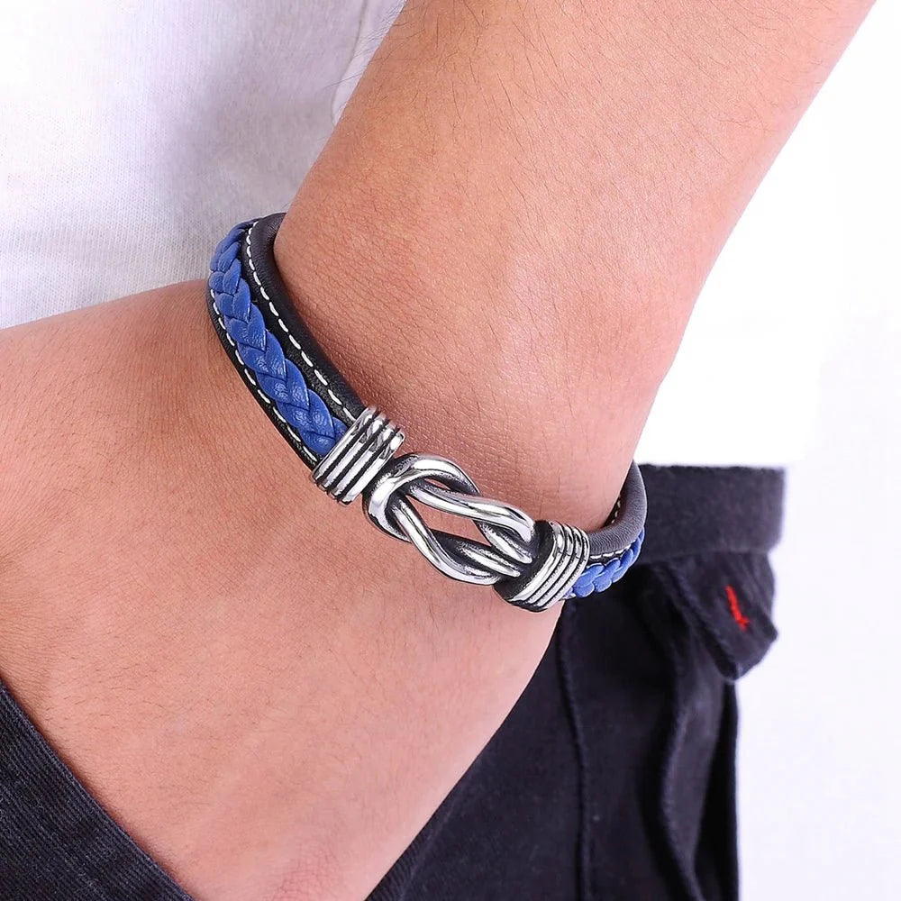 Unisex Eternal Love Knot Leather Bracelet bracelet with blue and black braided design worn on a wrist against a white background.