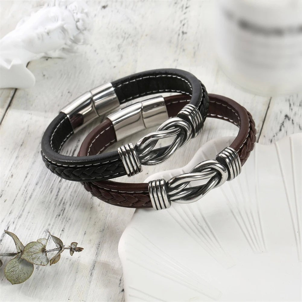 Unisex Eternal Love Knot Leather Bracelet two brown leather bracelets with silver metal accents displayed on a light wooden surface.