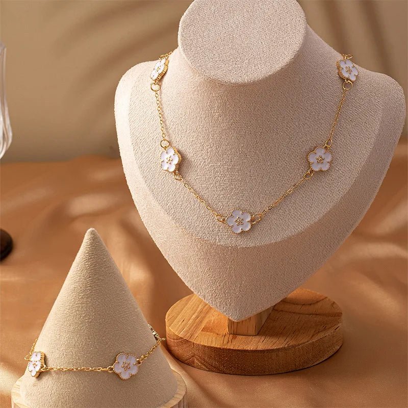 White accented clover necklace and bracelet set